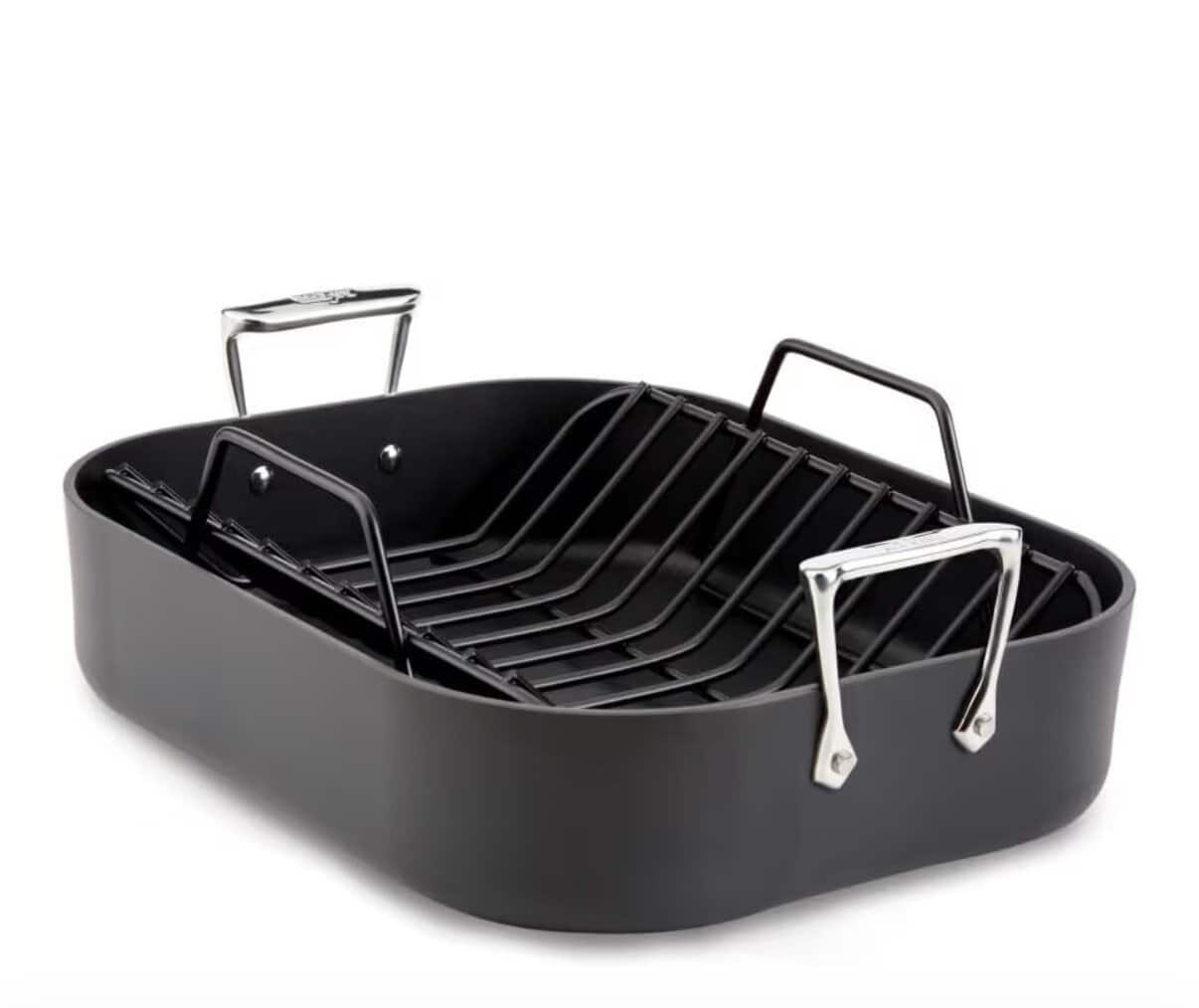 A nonstick black roasting pan with a removable metal rack, perfect for making Greek Restaurant-Style Lemon Roasted Potatoes, featuring two shiny stainless steel handles on each side and displayed on a white background.