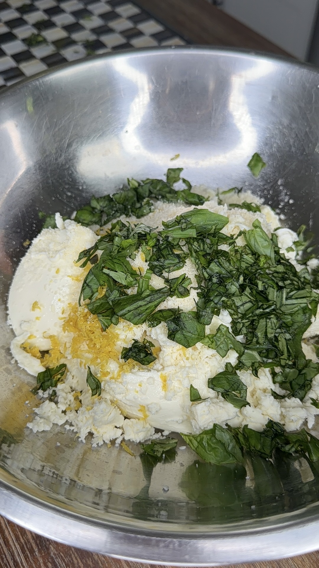 A bowl of food with green leaves.