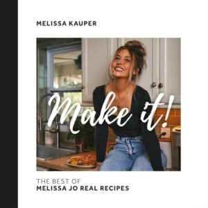 A woman sits on a kitchen counter, smiling and looking up. Text over the image reads “Make it!” and below, “The best of Melissa Jo Real Recipes” with “Melissa Kauper” at the top.