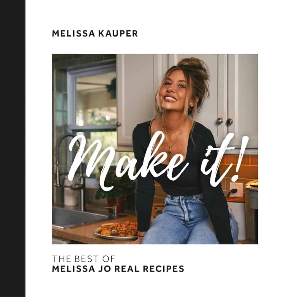 A woman sits on a kitchen counter, smiling and looking up. Text over the image reads “Make it!” and below, “The best of Melissa Jo Real Recipes” with “Melissa Kauper” at the top.