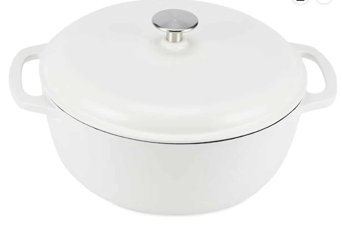 A white Dutch oven with a lid and silver knob, featuring two side handles, on a plain background.